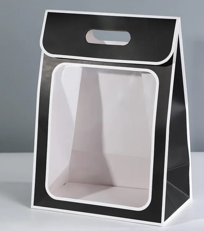 BOLSA O CAJA DE REGALO EN COLOR NEGRO CON BORDES BLANCOS  Y UN PANEL FRONTAL TRANSPARENTE